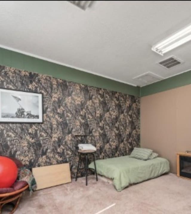 bedroom with carpet floors and visible vents