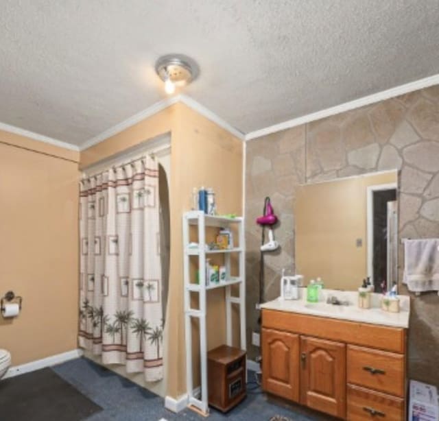 full bathroom with toilet, a textured ceiling, crown molding, and vanity