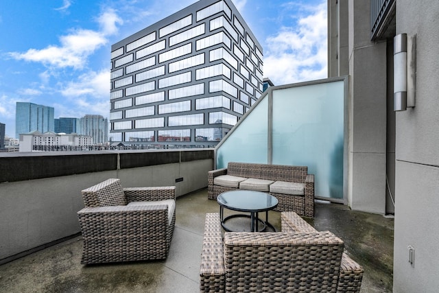 view of patio / terrace with a view of city and an outdoor hangout area