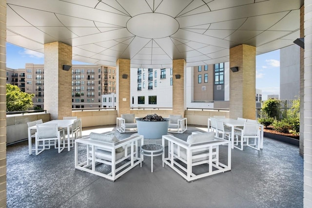 view of patio / terrace featuring outdoor dining area and a city view