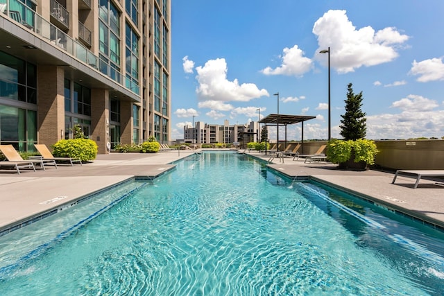 community pool featuring a patio area