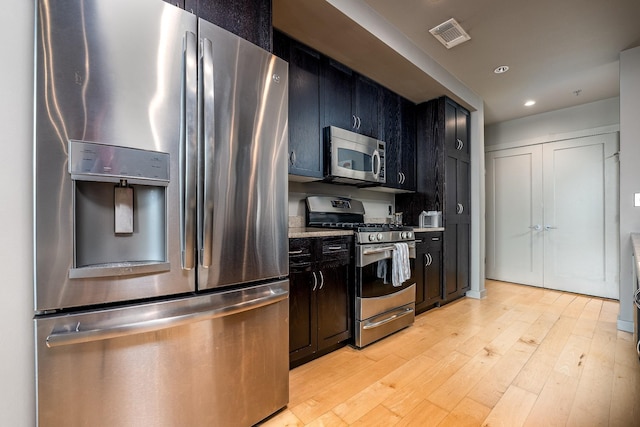 kitchen with visible vents, appliances with stainless steel finishes, light countertops, light wood-type flooring, and recessed lighting