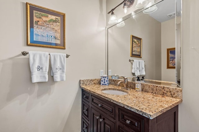 bathroom featuring visible vents and vanity