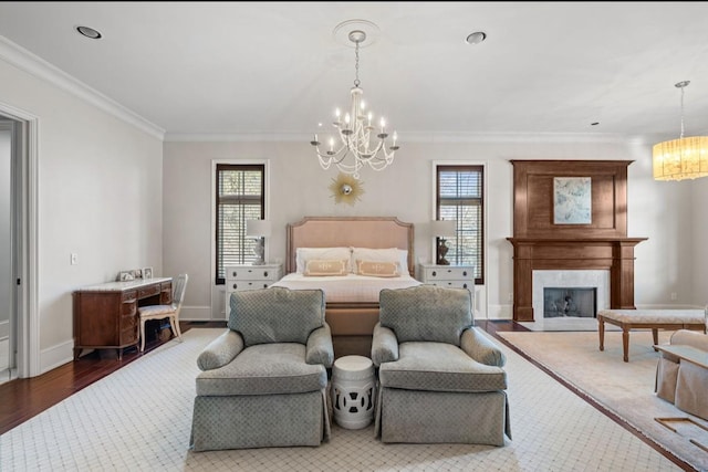 bedroom with a fireplace, an inviting chandelier, ornamental molding, wood finished floors, and baseboards