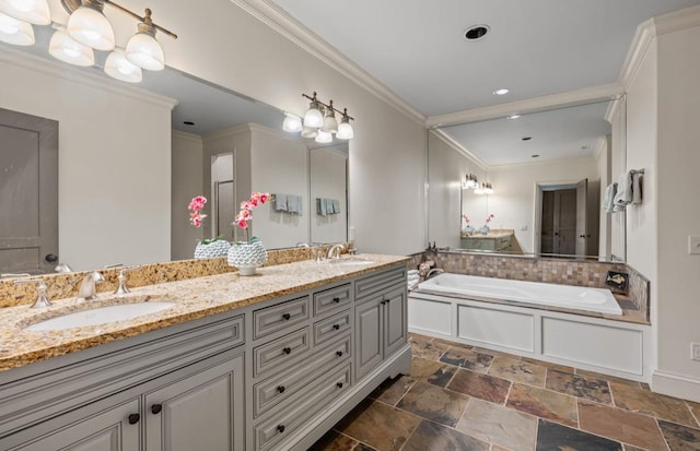 full bathroom featuring a garden tub, ornamental molding, and a sink