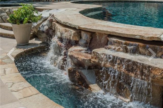 exterior space featuring a hot tub