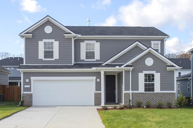 traditional home with an attached garage, brick siding, fence, driveway, and a front yard