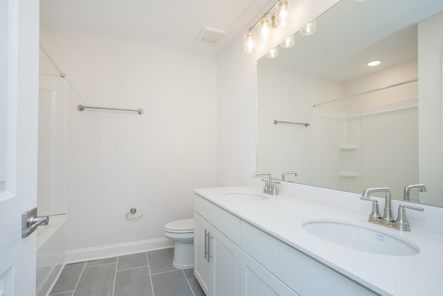 full bathroom featuring toilet, shower / bath combination, a sink, and baseboards