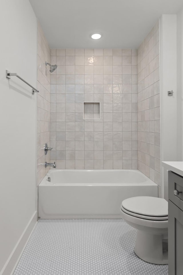 bathroom with toilet, tile patterned flooring, tub / shower combination, and vanity