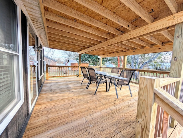 wooden deck featuring outdoor dining area