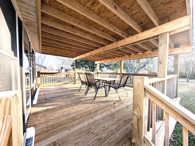 wooden deck featuring outdoor dining space