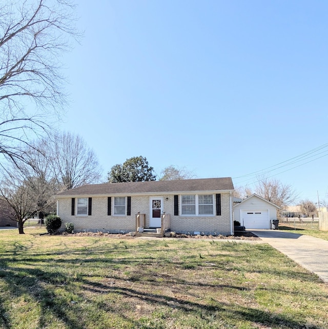 ranch-style house with an outbuilding, a front yard, driveway, a garage, and brick siding