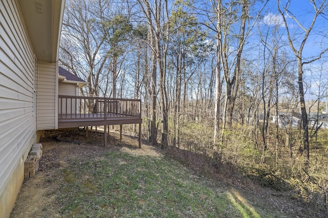 view of yard with a wooden deck