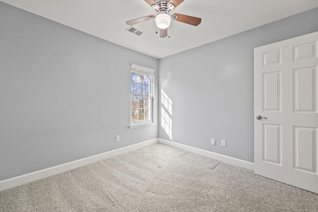 unfurnished room featuring visible vents, baseboards, ceiling fan, and carpet flooring