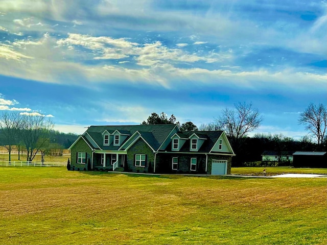 view of front of home featuring a front yard and an attached garage