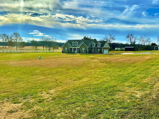 view of property's community featuring a yard