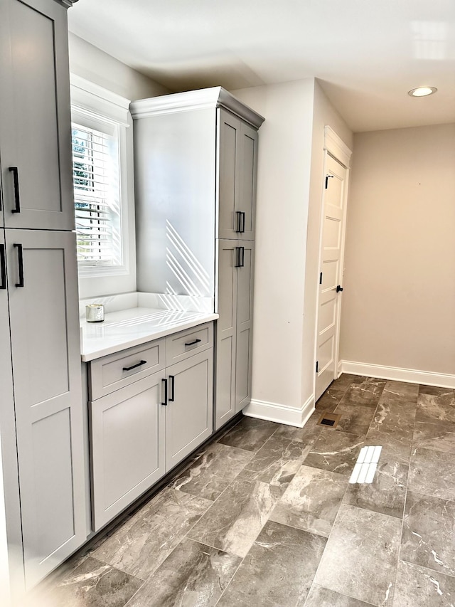 interior space featuring recessed lighting and baseboards