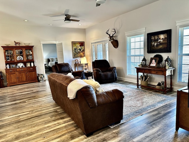 living room with recessed lighting, ceiling fan, baseboards, and wood finished floors