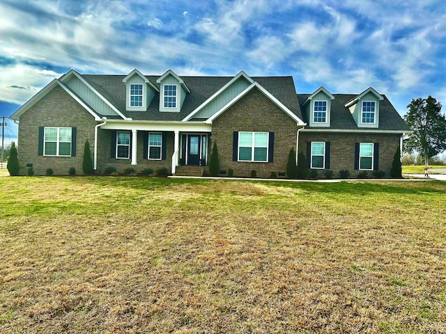 view of front of property featuring crawl space, a front yard, and brick siding