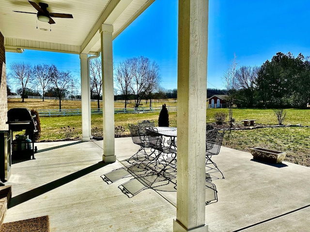 view of patio with a ceiling fan, outdoor dining space, and grilling area