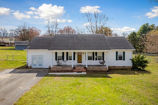 view of front of property with roof with shingles, crawl space, fence, a porch, and a front yard