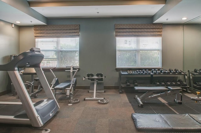 workout area featuring baseboards and a wealth of natural light