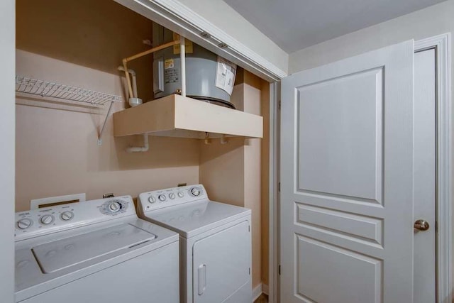 clothes washing area featuring laundry area and washer and dryer