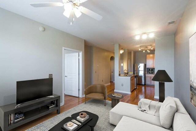 3000 Vanderbilt Pl Unit 421, Nashville, TN 37212 - living room featuring visible vents, baseboards, a ceiling fan, and wood finished floors