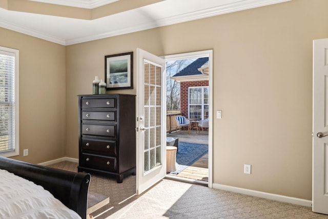 carpeted bedroom with access to exterior, baseboards, ornamental molding, and french doors