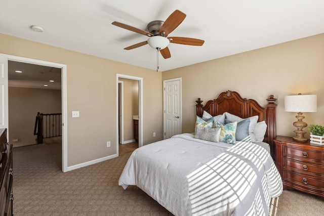 carpeted bedroom with a ceiling fan, baseboards, and a closet