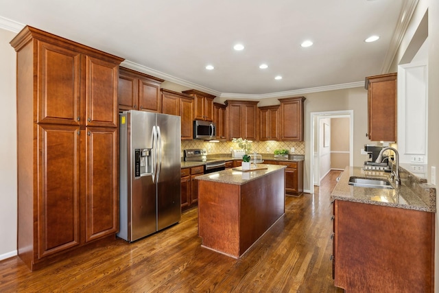 kitchen featuring stone countertops, dark wood-style floors, a sink, stainless steel appliances, and backsplash