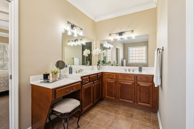 ensuite bathroom featuring double vanity, ornamental molding, a sink, and connected bathroom