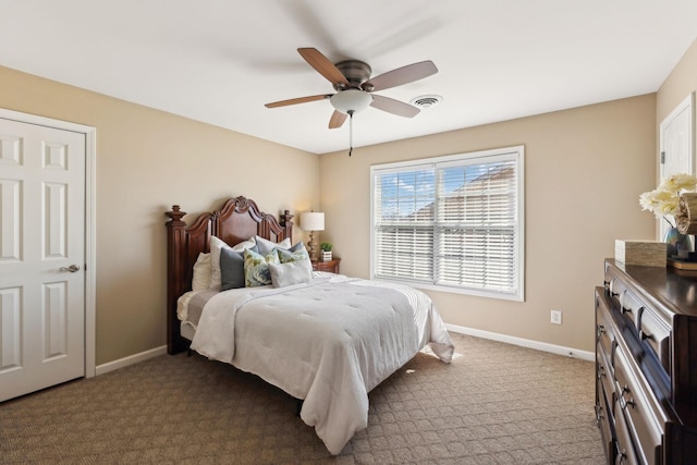 bedroom featuring carpet floors, visible vents, ceiling fan, and baseboards