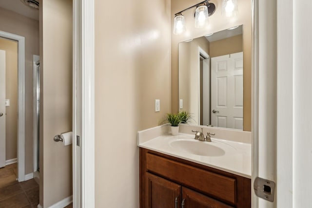 bathroom featuring tile patterned flooring and vanity