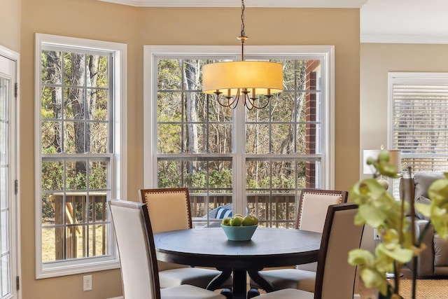 dining area with crown molding