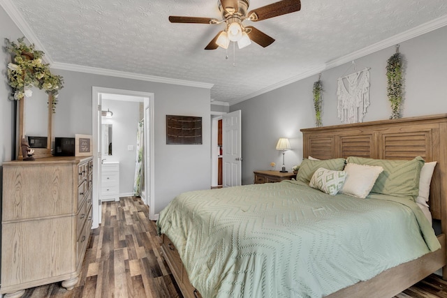 bedroom with crown molding, dark wood finished floors, and a textured ceiling