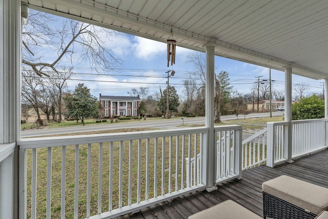 wooden deck featuring covered porch