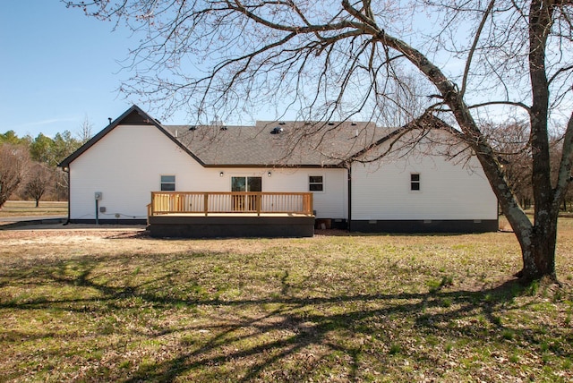 back of property featuring crawl space, a lawn, and a wooden deck