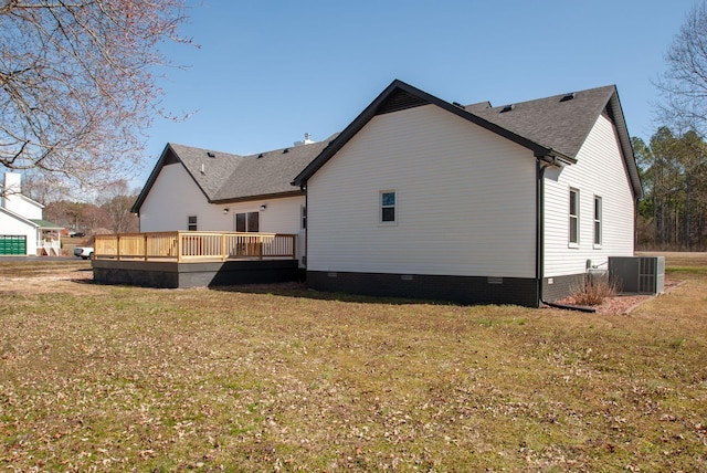 back of property with crawl space, a yard, a wooden deck, and central air condition unit