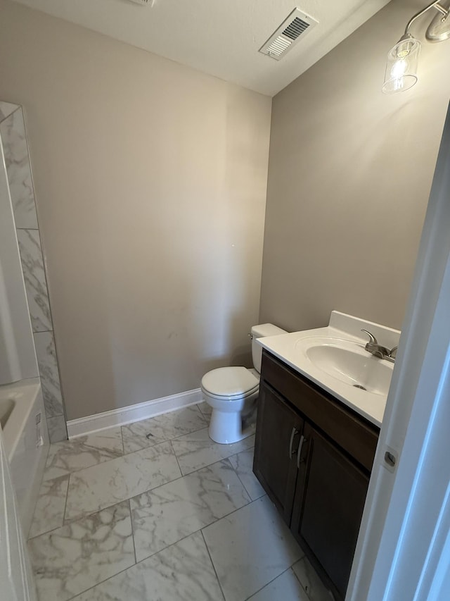 156 Cardinal Crk, Clarksville, TN 37040 - bathroom with marble finish floors, vanity, toilet, a bathtub, and baseboards
