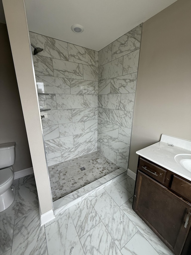 156 Cardinal Crk, Clarksville, TN 37040 - bathroom featuring marble look tiles, toilet, baseboards, and vanity
