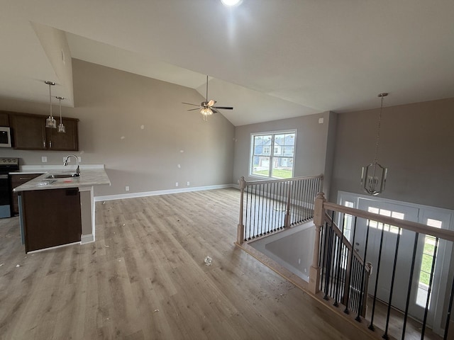 156 Cardinal Crk, Clarksville, TN 37040 - kitchen featuring a sink, stainless steel appliances, light wood-style flooring, a ceiling fan, and lofted ceiling