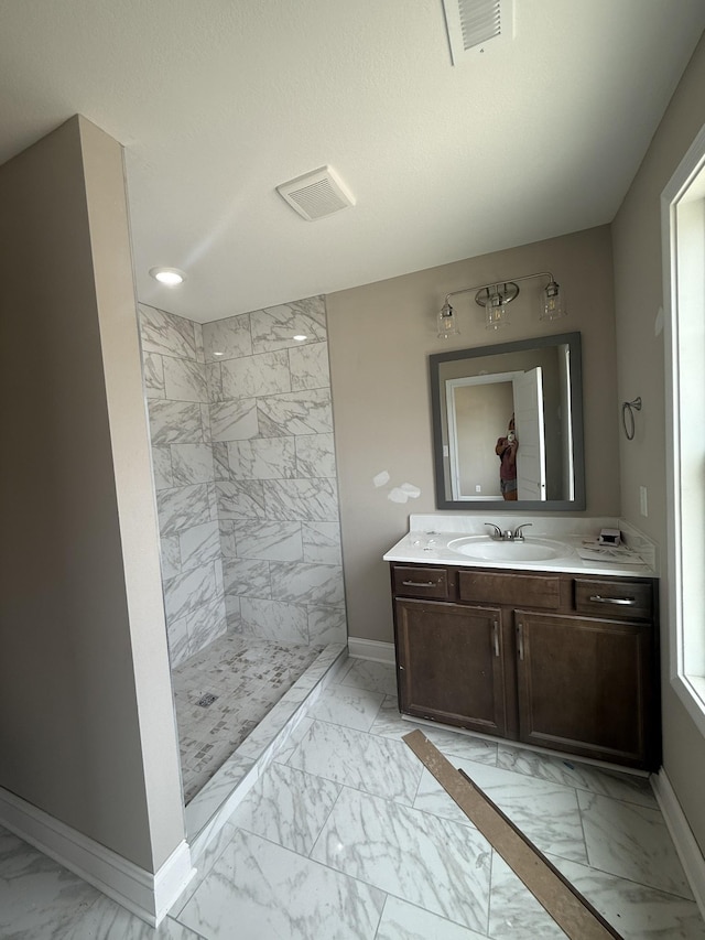 156 Cardinal Crk, Clarksville, TN 37040 - full bathroom with marble finish floors, baseboards, tiled shower, vanity, and recessed lighting