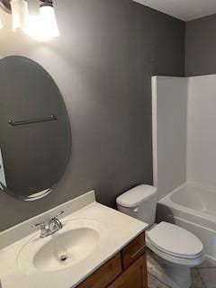 bathroom featuring toilet, shower / bathing tub combination, vanity, and tile patterned floors