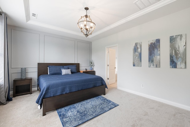 bedroom featuring a tray ceiling, visible vents, a chandelier, and carpet flooring