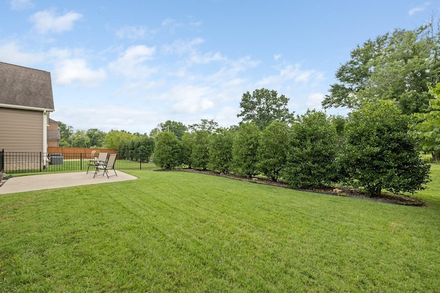 view of yard featuring fence and a patio