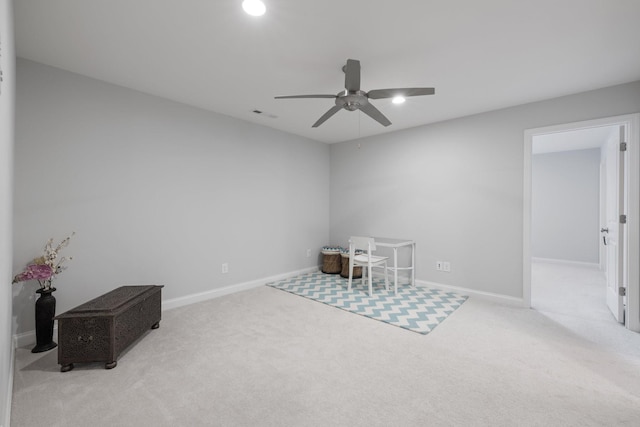 carpeted office featuring visible vents, ceiling fan, and baseboards