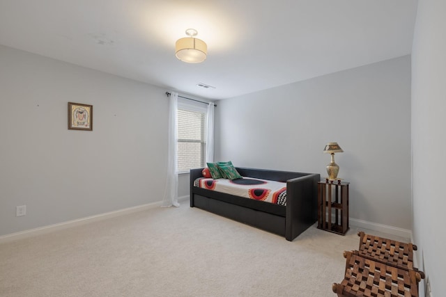 carpeted bedroom featuring visible vents and baseboards