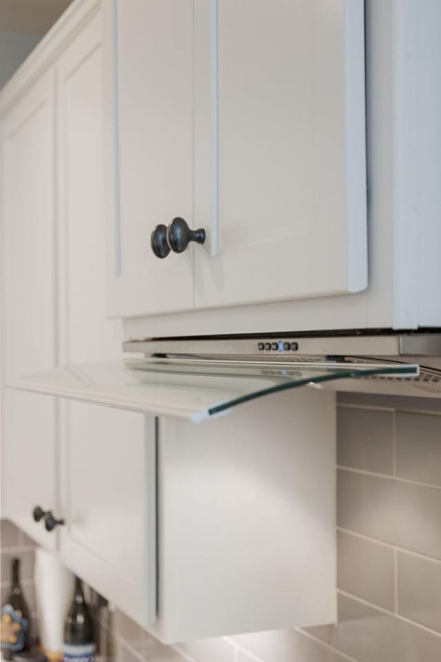 room details with light countertops and white cabinetry