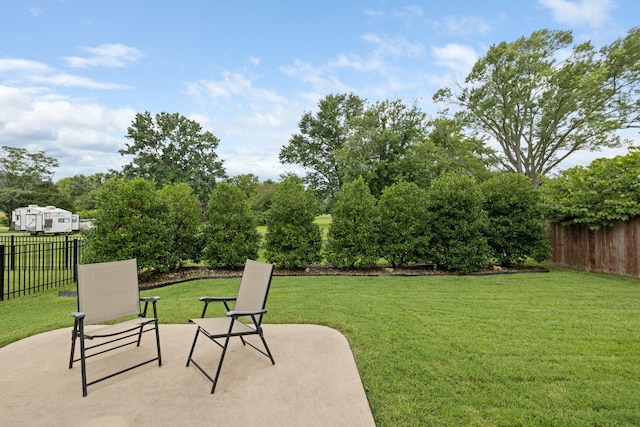 view of yard with a patio area and fence